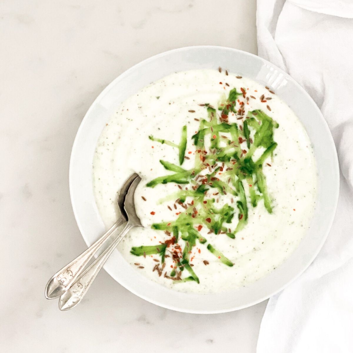 Cucumber and Herb Raita in a white bowl