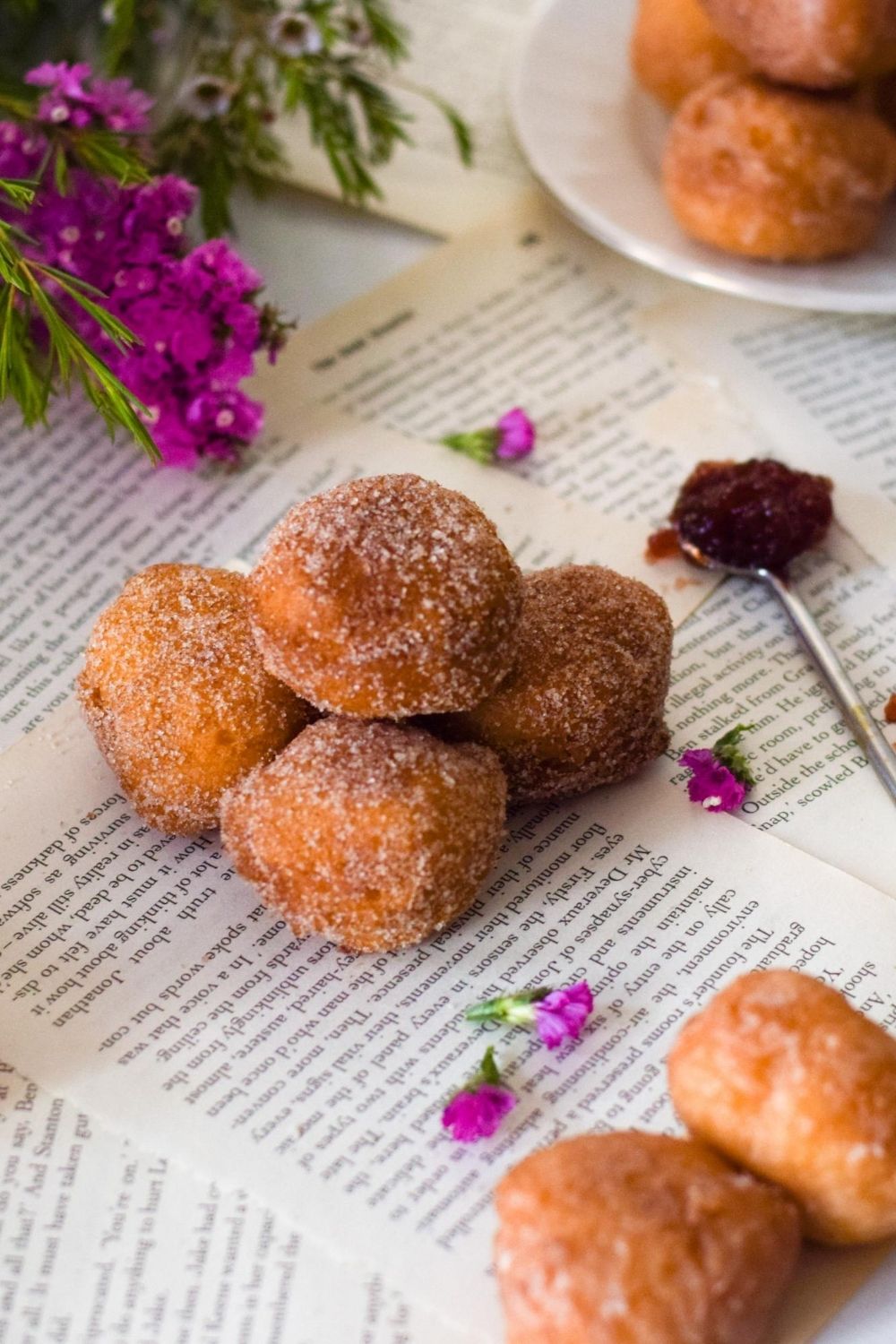 Doughnut Holes on paper with flowers on left and jam on right