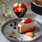 A pice of no bake chocolate cheesecake on a plate