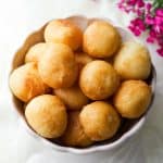 Gulgula in a white bowl with pink flowers at the top right