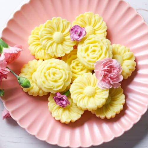 Milk Burfi in a pink plate with pink flowers