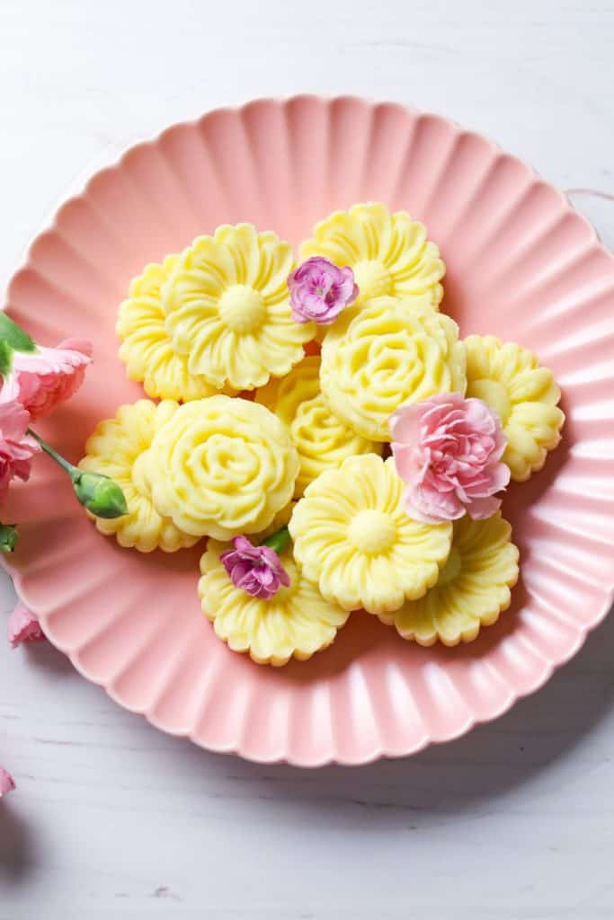 Milk Burfi in a pink plate with pink flowers