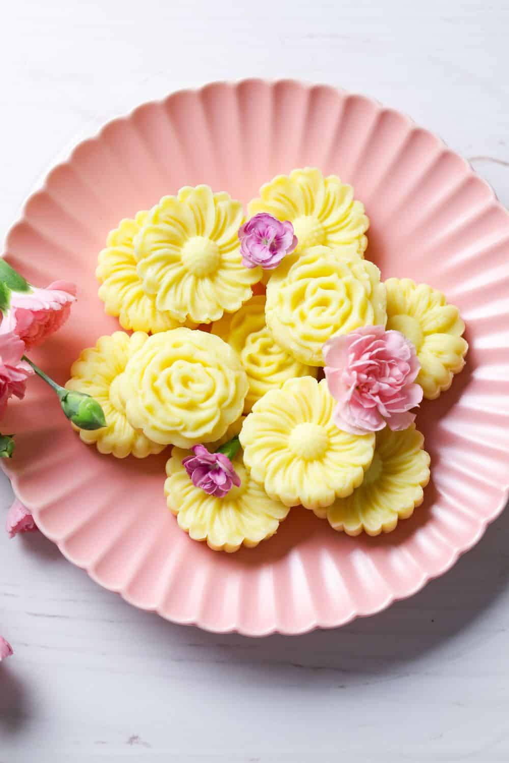 Milk Burfi in a pink plate with pink flowers 