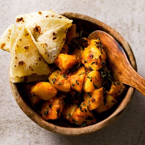 Aloo Methi in a brown wooden bowl