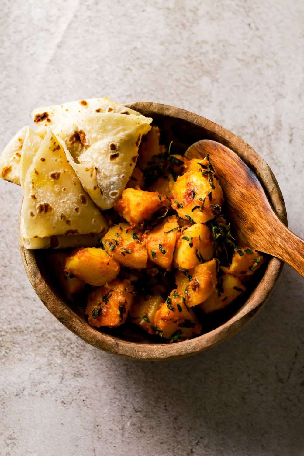 Aloo Methi in a brown wooden bowl