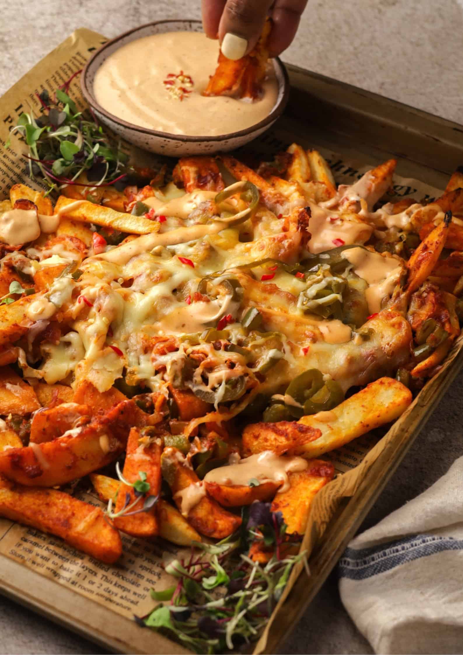 Spicy Fully Loaded Fries made with crispy steakhouse chips and spicy seasoning